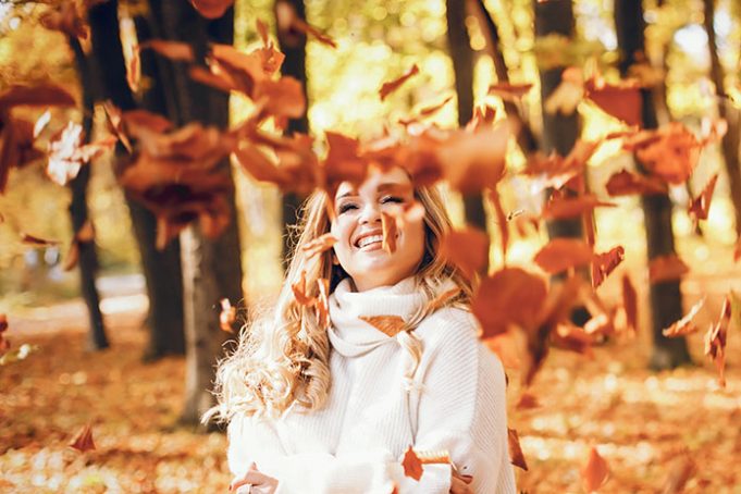 Elegant girl in a sunny autumn park