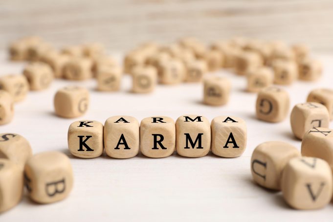 Word,Karma,Made,Of,Cubes,With,Letters,On,White,Table