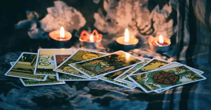 close-up-illuminated-candles-table